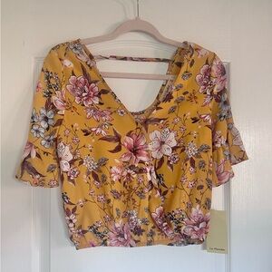 Live to be Spoiled Juniors Floral V-Neck faux wrap Crop Top in Mustard & pink
